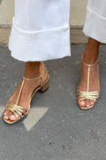 Allegra · Sandali dorati con tacco basso